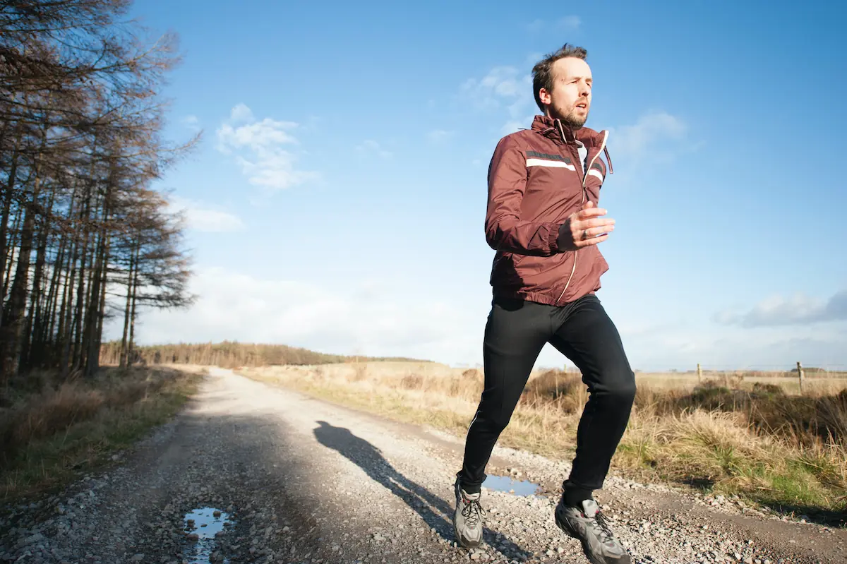 man running outside on a trail