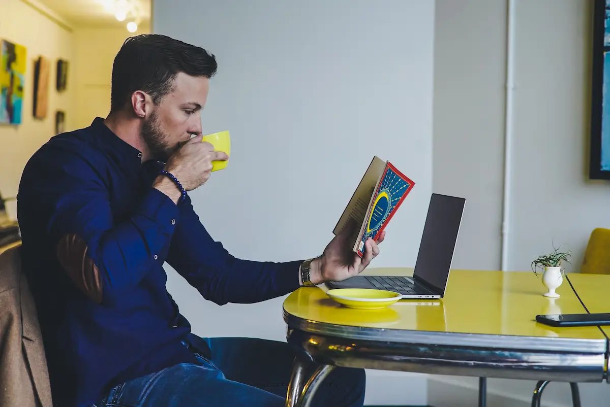 person re-reading a book